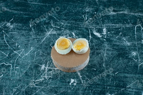 Preview: Boiled eggs isolated on a wooden platter
