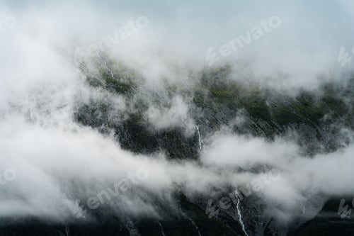 Preview: Beautiful view of a landscape with mountains and clouds in Alaska