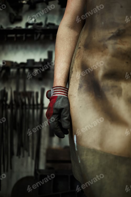 Preview: Blacksmith in glove and dirty apron