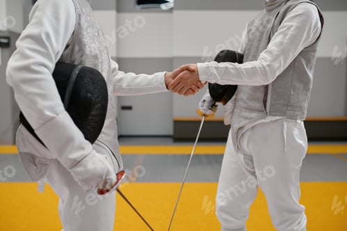 Preview: Professional fencers shaking hand after or before fencing match