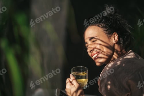 Preview: woman drinking lemon tea