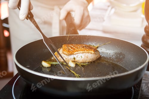 Preview: Meat and herbs on pan.