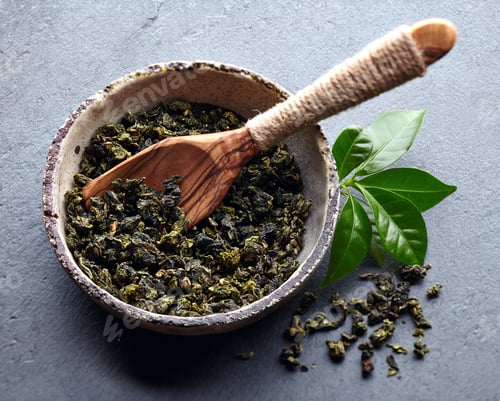 Preview: Dry green tea on graphite background