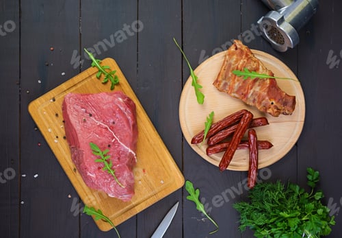 Preview: Raw meat. Fresh beef on wooden background