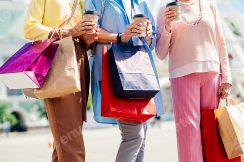 Preview: Beautiful happy senior women shopping in the city centre