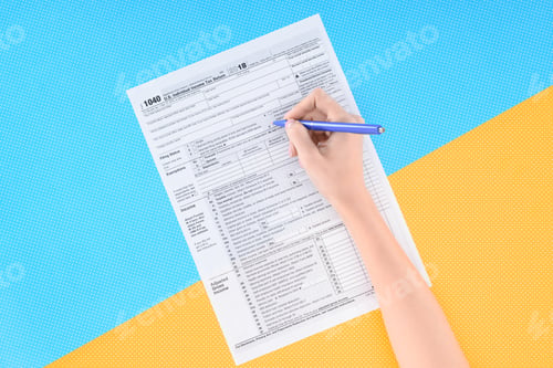 Preview: cropped view of woman filling tax form on blue and yellow background