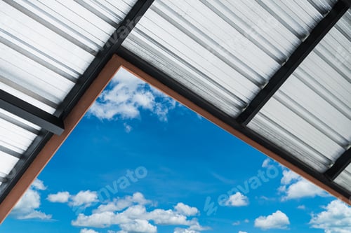 Preview: Metal sheet roof structure against blue sky on daylight well space for text