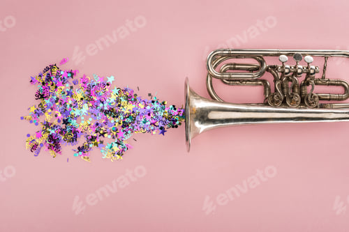 Preview: colorful confetti with trumpet on pink background