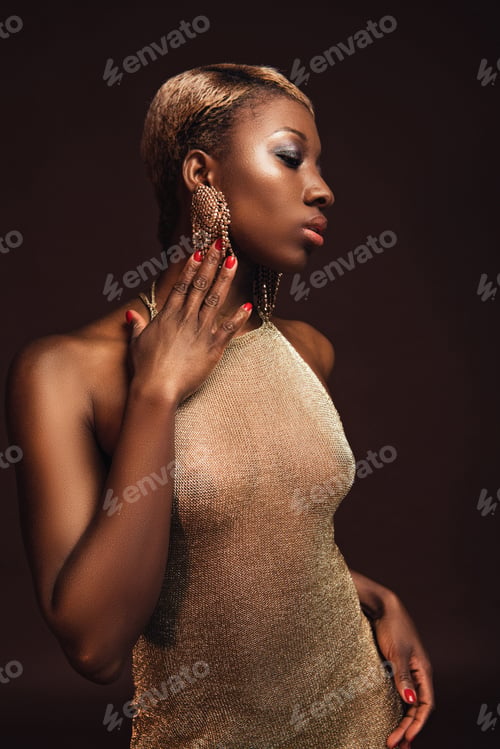 Preview: beautiful elegant african american woman with short hair isolated on brown