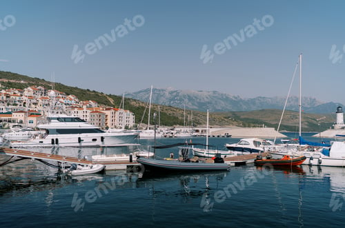 Preview: Inflatable motor boats stand next to yachts at the marina berths
