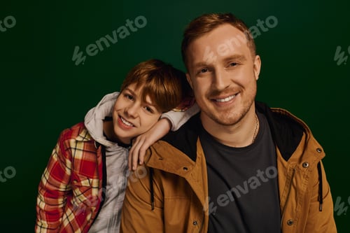 Preview: Joyful bond between father and son in a vibrant studio setting