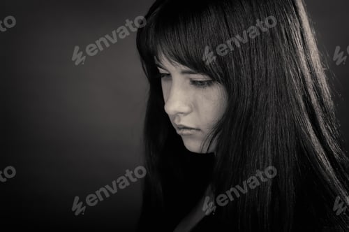 Preview: Portrait Of Brunette Girl On Dark Background