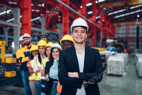 Preview: Team and portrait of engineering employees standing in an industrial.