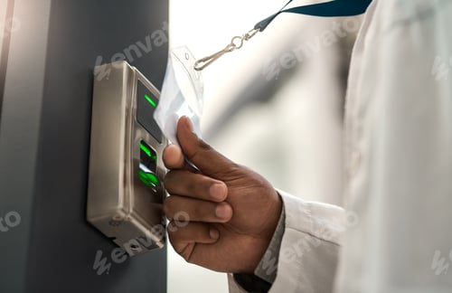 Preview: Closeup shot of an unrecognisable scientist using an access card to gain entry at a door