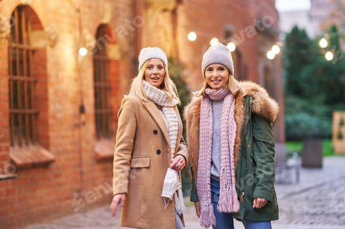Preview: Two women wearing face masks and hanging out in the city