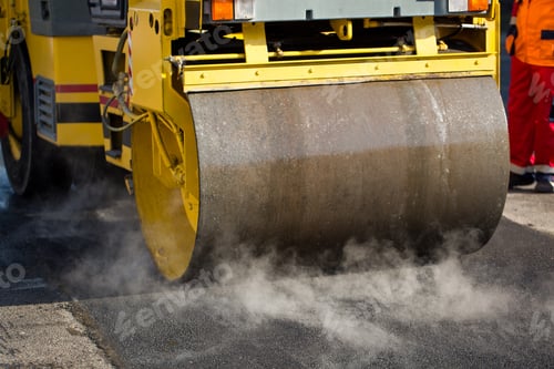 Preview: Road repairs. Compact steamroller flatten out the asphalt