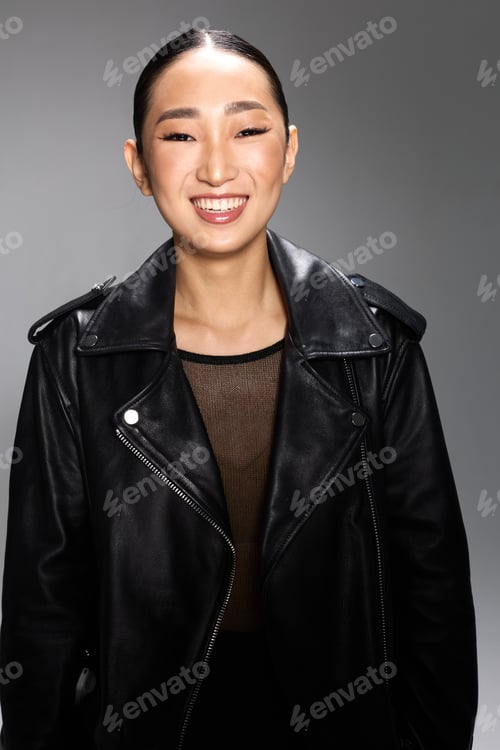 Preview: Asian woman black leather jacket black top smile camera a fashionable asian woman poses in a black