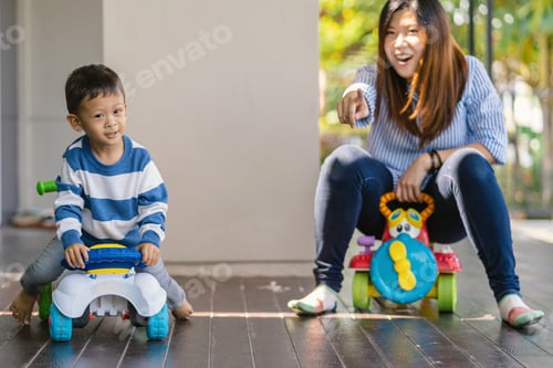 Preview: Asian single mom with son are playing with car toy together when living in modern house