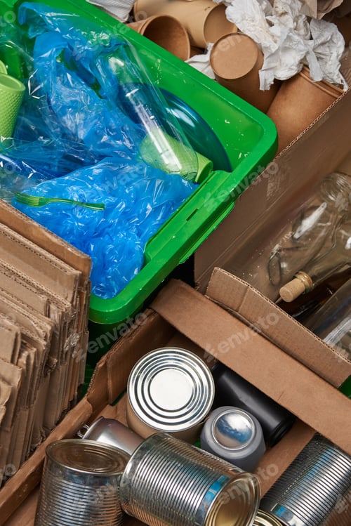 Preview: sorted trash of cardboard, glass and plastic bottles, polyethylene, cups, iron cans