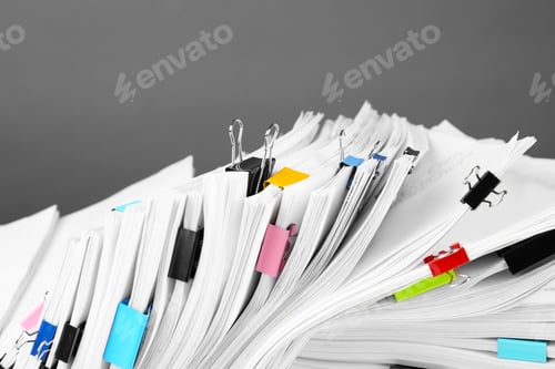 Preview: Pile of documents with colorful binder clips, closeup