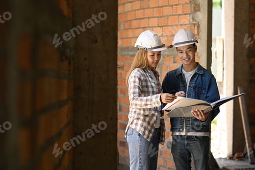 Preview: Specialists inspecting commercial building Construction site with civil engineer.