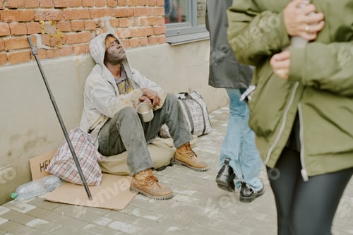 Preview: Homeless Black Man Sitting Outdoors Begging for Money on City Street