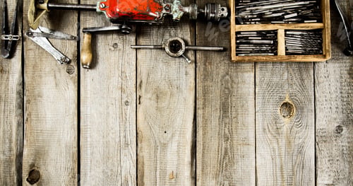 Preview: Many working tools on a wooden background.