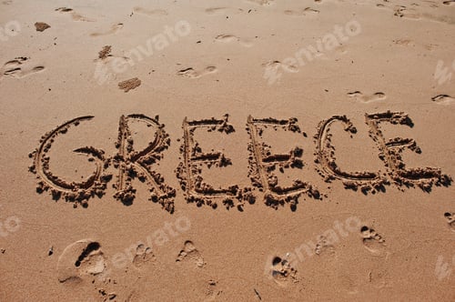 Preview: "Greece" written in the sand on the beach