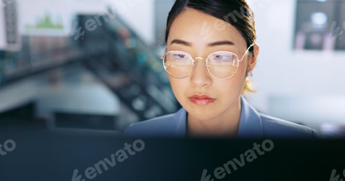 Preview: Face, glasses and management with a business asian woman at work on a computer in her office. Data,