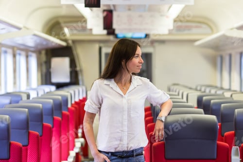 Preview: Young happy girl traveling by train