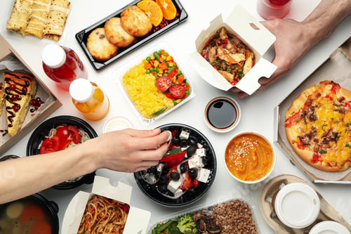 Preview: People eat takeaway. Food delivery. Tasty food on white table