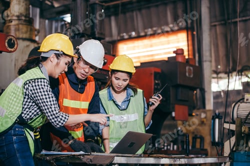 Preview: Asian engineer foreman training trainee working on factory system