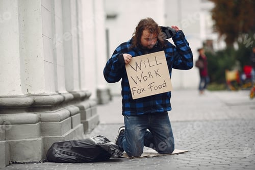 Preview: Homeless man in a durty clothes autumn city
