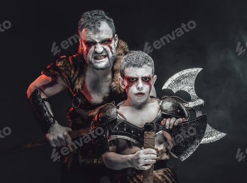 Preview: Posing together warlike father and son in dark background