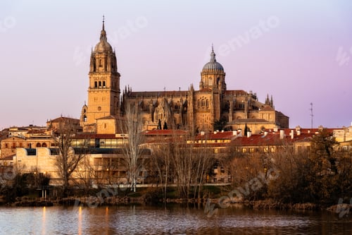 Preview: Scenic view of Salamanca at sunset with the cathedral reflected in the Tormes river