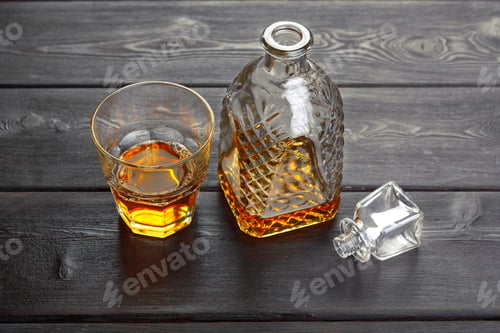 Preview: Whisky bottle on dark wooden background flat lay