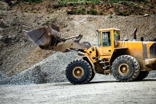 Preview: Close up details of wheel loader with scoop working on construction site