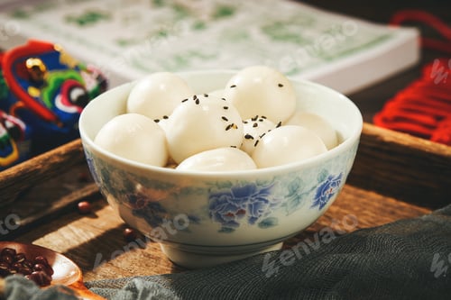 Preview: Closeup of a bowl of glutinous rice balls on the table in a Chinese restaurant