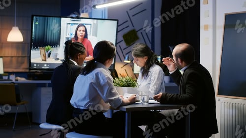 Preview: Diverse multi ethnic businesspeople discussing with remote entrepreneur during online videocall