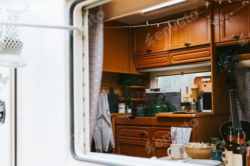 Preview: cozy kitchen interior in the trailer of mobile home or recreational vehicle, concept of family local