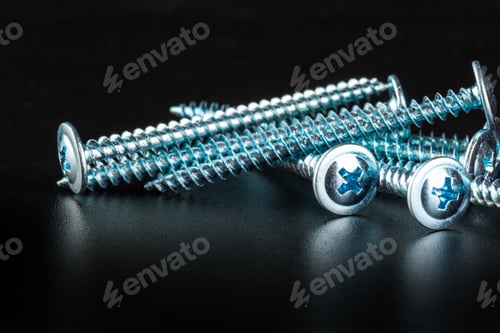 Preview: screws on black background