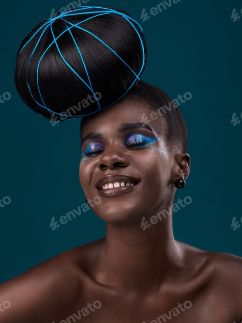 Preview: Studio shot of a beautiful young woman posing against a dark background