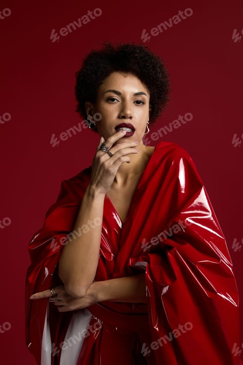 Preview: Stunning young woman showcases bold fashion in striking red attire