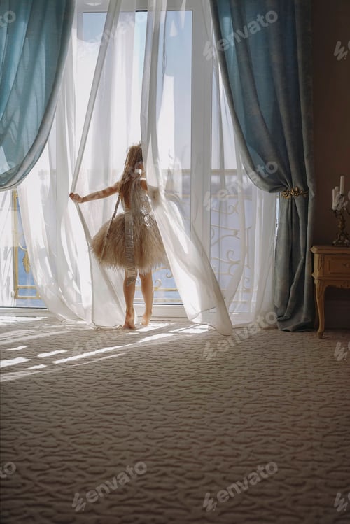 Preview: Little girl looking out big window on sunny morning, sea view apartment