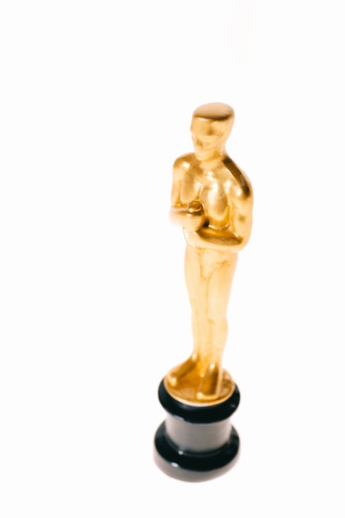 Preview: shiny golden oscar trophy isolated on white