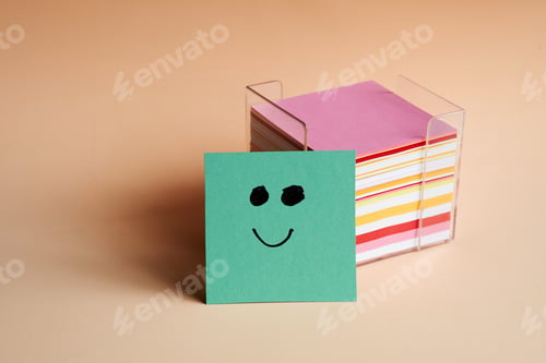 Preview: Colorful sticky notes with a smiling face on a green note