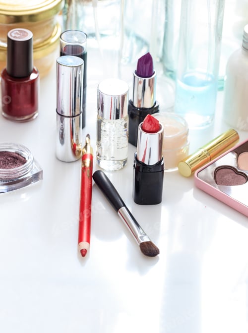 Preview: Set of makeup cosmetics on white background. Vertical, close up view.