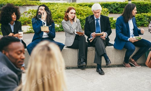 Preview: Business people doing lunch break with healthy food outdoor from office building