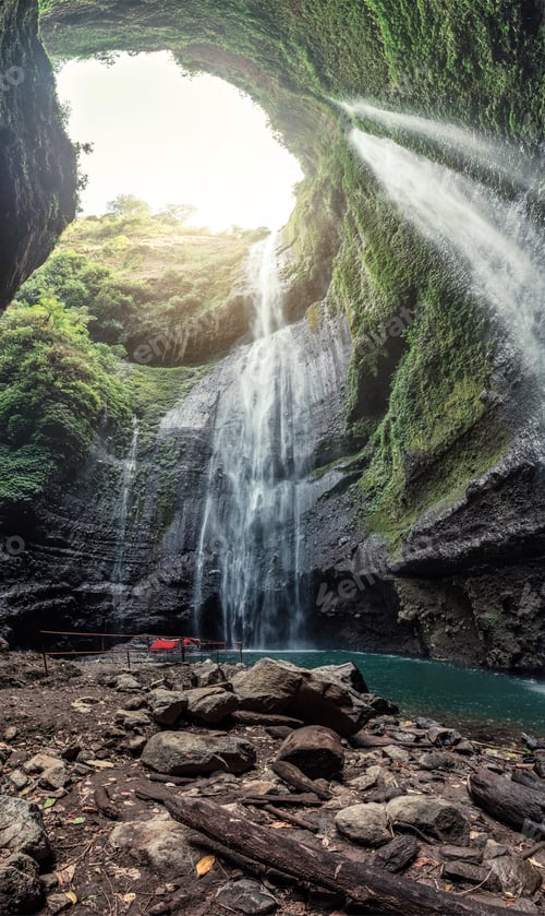 Preview: Majestic Madakaripura waterfall flowing in rocky valley