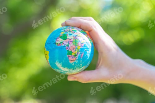 Preview: Human hands holding global earth ball. Sustain earth concept. Love nature. Save the planet.